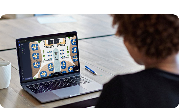 A photo of a woman using Gather on her laptop.